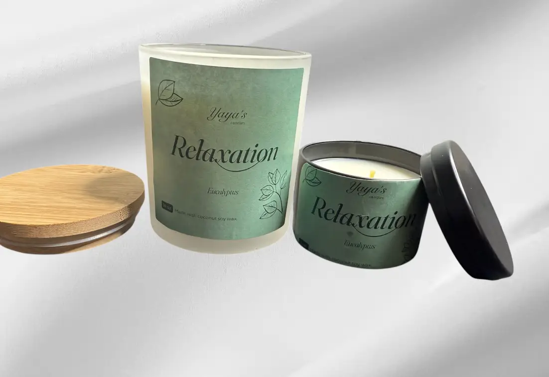 Eucalypus product-images-for-front-end Two candles labeled "Relaxation" in eucalyptus scent, one glass with a wooden lid and one metal tin, on a soft gray background.